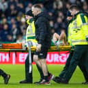 Hibs' Josh Campbell is stretchered off injured during the derby against Hearts.