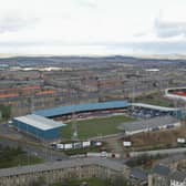 Tale of two grounds: Dundee's Dens Park sits in the foreground and Tannadice, home of rivals Dundee United, sits beyond it.