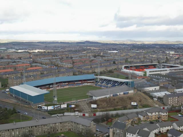 Tale of two grounds: Dundee's Dens Park sits in the foreground and Tannadice, home of rivals Dundee United, sits beyond it.