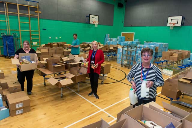 Volunteers packing food parcels at Craigroyston High School for distribution around the city during the pandemic.