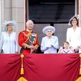 The Queen smiles on the balcony of Buckingham Palace during Trooping the Colour alongside