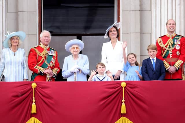 The Queen smiles on the balcony of Buckingham Palace during Trooping the Colour alongside