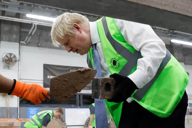 Boris Johnson takes a break from his Westminster woes on a visit to Hopwood Hall College, Greater Manchester, on Thursday (Picture: Jason Cairnduff-WPA pool/Getty Images)