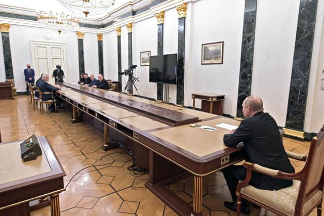 Vladimir Putin chairs a meeting at the Kremlin in Moscow shortly after his invasion of Ukraine began (Picture: Alexey Nikolsky/Sputnik/AFP via Getty Images)