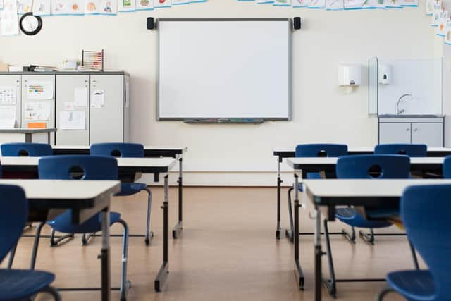 School desk and chairs in empty modern classroom. PIC: Rido - stock.adobe.com