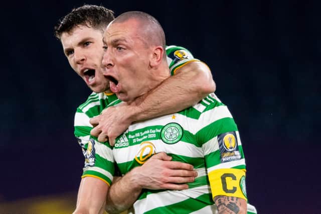 Ryan Christie celebrates with Celtic captain Scott Brown after winning the 2020 Scottish Cup.