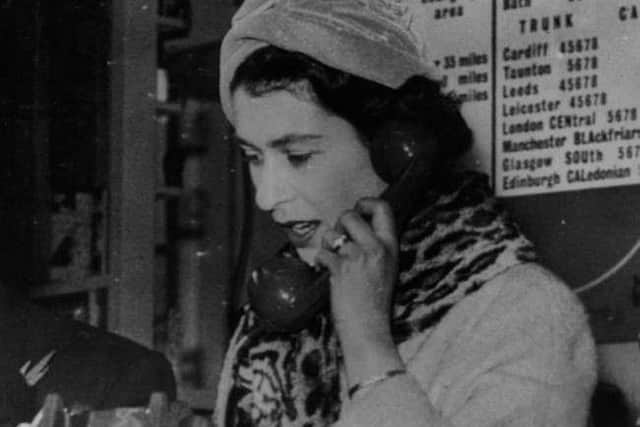 The Queen speaks on a telephone at the Bristol exchange making Britain's first subscriber trunk dialled telephone call to Edinburgh in 1958.