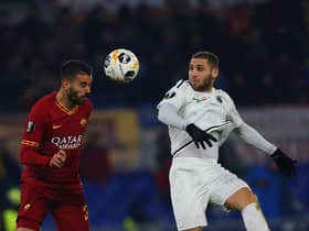 Shon Weissman of Wolfsberger AC in action with Leonardo Spinazzola of AS Roma during a Europa League match in December 2019