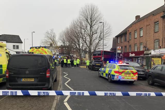 Emergency services at the scene on The Broadway in Highams Park, east London, where a number of people are being treated by paramedics from the London Ambulance Service after a bus collided with a building. Picture date: Tuesday January 25, 2022.