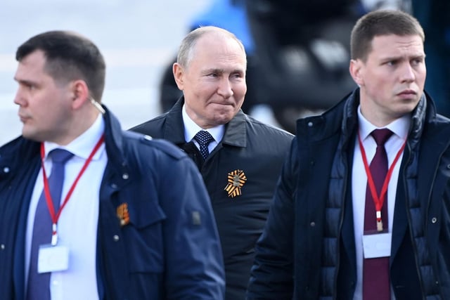 Russian President Vladimir Putin leaves Red Square after the Victory Day military parade in central Moscow on May 9, 2022