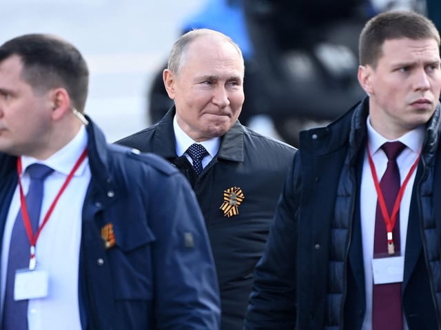 Russian President Vladimir Putin leaves Red Square after the Victory Day military parade in central Moscow on May 9, 2022