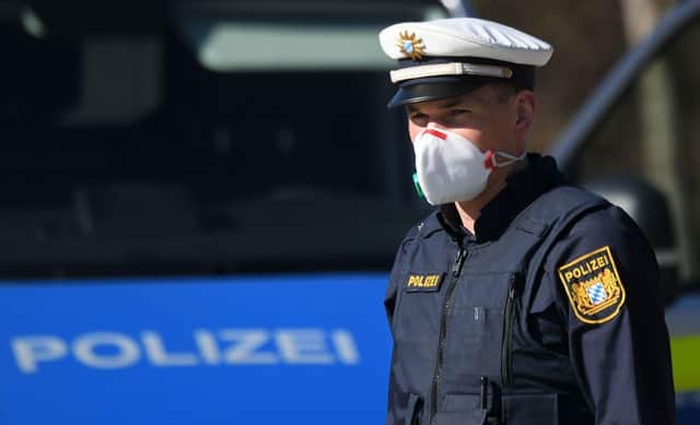 A German police officer wearing a protective face mask (Photo: CHRISTOF STACHE/AFP via Getty Images)