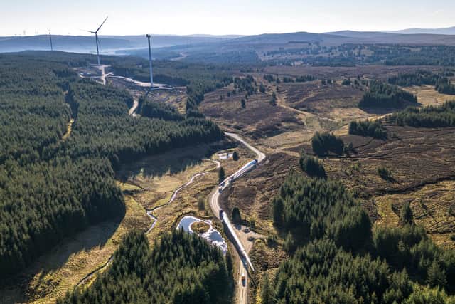 Turbine blades bound for the Mill Rig Wind farm snake their way through the countryside.