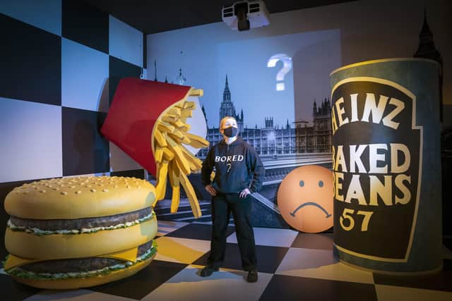 V&A Dundee visitor assistant Rachel Corr stands in the set created for Michael Clark's Edinburgh International Festival show 'I Am Curious, Orange'. Picture: Jane Barlow/PA Wire