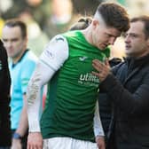 Kevin Nisbet gets a pat from Hibs manager Shaun Maloney after going off injured against Celtic. (Photo by Ross Parker / SNS Group)