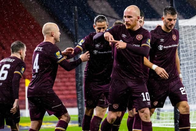 Steven Naismith, far left, celebrates with his team-mates after Liam Boyce's winner.
