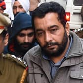 Jagtar Singh Johal, centre, is escorted to a court in Ludhiana in India's northern Punjab state after his arrest in 2017 (Picture: Shammi Mehra/AFP via Getty Images)