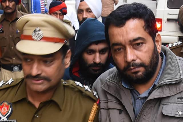 Jagtar Singh Johal, centre, is escorted to a court in Ludhiana in India's northern Punjab state after his arrest in 2017 (Picture: Shammi Mehra/AFP via Getty Images)