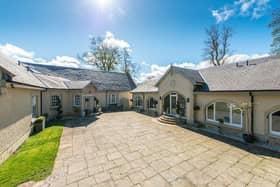 Front entrance to main house on left and coach house on right.