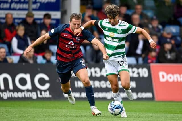 Celtic's Jota (R) and Ross County's Ben Purrington are two of the summer's permanent transfers.  (Photo by Rob Casey / SNS Group)