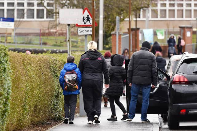Children make their way to school. stock photo