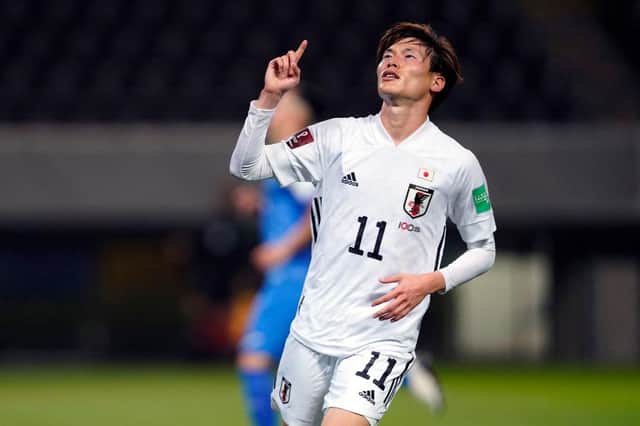 Kyogo Furuhashi of Japan celebrates scoring his side's eleventh goal during the FIFA World Cup Asian Qualifier second round between Mongolia and Japan at Fukuda Denshi Arena on March 30, 2021 in Chiba, Japan.  (Photo by Toru Hanai/Getty Images)