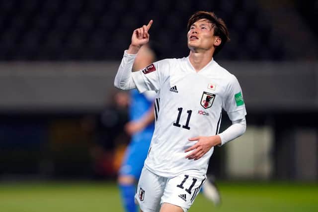 Kyogo Furuhashi of Japan celebrates scoring his side's eleventh goal during the FIFA World Cup Asian Qualifier second round between Mongolia and Japan at Fukuda Denshi Arena on March 30, 2021 in Chiba, Japan. (Photo by Toru Hanai/Getty Images)