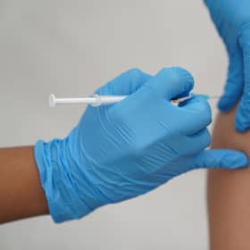 A person receiving a Covid-19 jab. Picture: PA