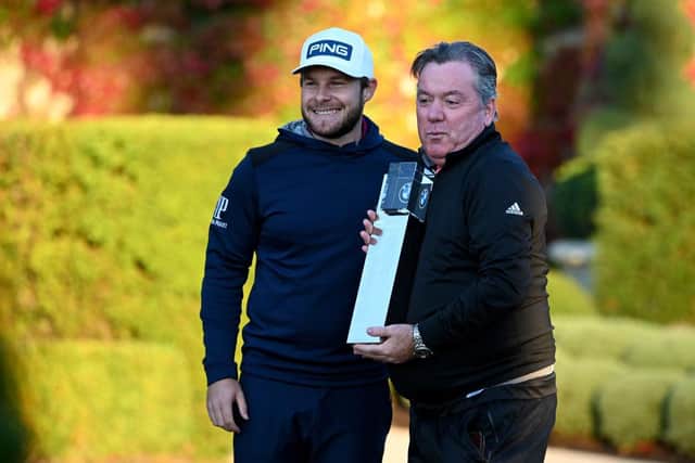 Tyrrell Hatton and his caddie Mick Donaghy with the winners trophy after the final round of the BMW PGA Championship at Wentworth in October. Picture: Ross Kinnaird/Getty Images