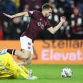 Hearts' Alan Forrest goes down in the box before being shown a yellow card for diving in the 2-2 draw with Ross County. His manager was adamant it should have been a penalty. Photo by Roddy Scott / SNS Group