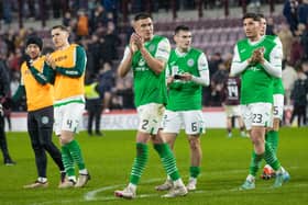 The Hibs player applaud the away fans after the 1-1 draw against Hearts.