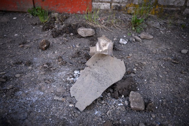 A large piece of missile fragment is seen outside an electricity substation the morning after a rocket strike, on May 04, 2022 in Lviv, Ukraine.  Photo by Leon Neal/Getty Images