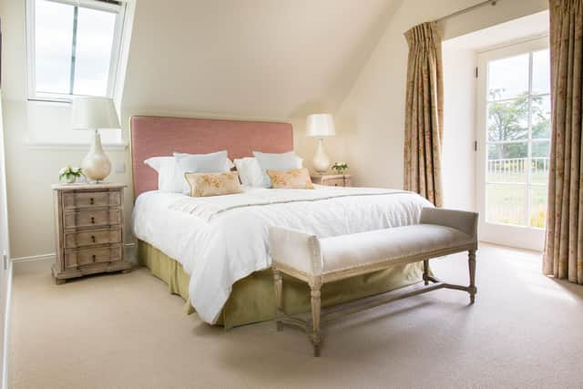 A bedroom in Red Gates Cottage, with view of the paddock.