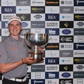 Sam Locke shows off the trophy after winning the Pollok Classic in a three-man play-off. Picture: Tartan Pro Tour.