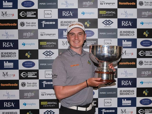 Sam Locke shows off the trophy after winning the Pollok Classic in a three-man play-off. Picture: Tartan Pro Tour.