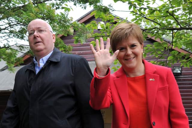First Minister of Scotland and Scottish National Party (SNP) leader Nicola Sturgeon (R) leaves with her husband Peter Murrell (L), Chief Executive of the SNP, after voting in the European Parliament elections at Broomhouse Community Hall in Glasgow on May 23, 2019.