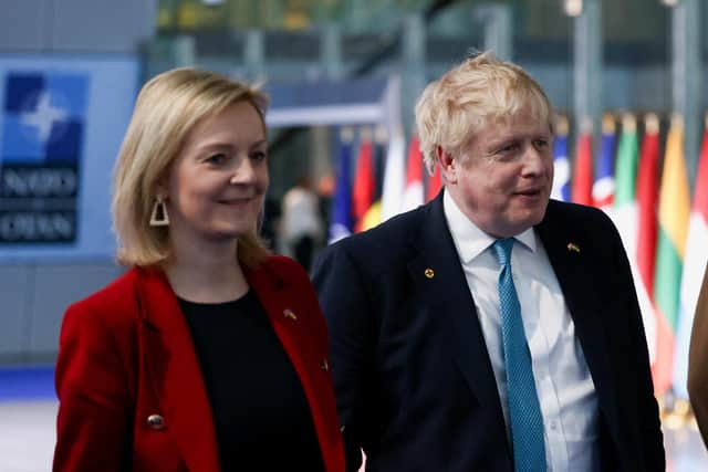 Outgoing Prime Minister Liz Truss, with her predecessor and possible successor Boris Johnson (Picture: Henry Nicholls/pool/Getty Images)