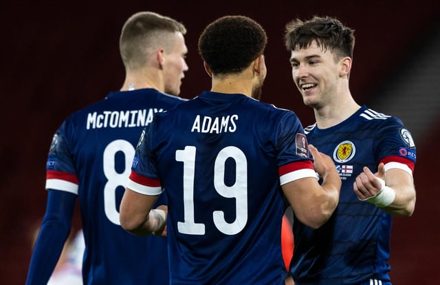 Che Adams, centre, scored his first goal for Scotland while Kieran Tierney, right, put in an excellent performance.