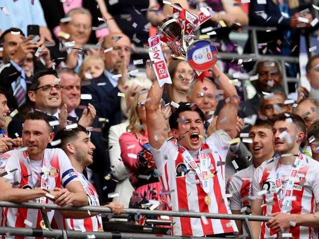 Luke O'Nien of Sunderland celebrates with the Sky Bet League One Play-Off trophy. (Photo by Justin Setterfield/Getty Images)
