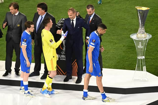 Rangers players collect their runners-up medals following their defeat to Eintracht Frankfurt in last season's Europa League final. (Photo by David Ramos/Getty Images)