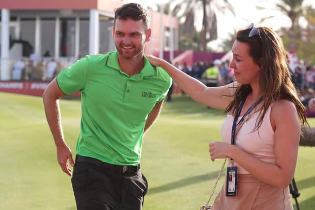 Daniel Gavins celebrates with his girlfriend Sarah-Louise after winning the Ras Al Khaimah Championship on a nervy final day.