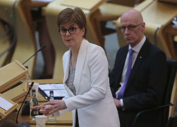 Nicola Sturgeon defended her Education Secretary John Swinney amid calls for him to resign.