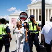 Anti-abortion activists protest near a Women's March rally in front of the US Supreme Court Building in June to mark the one year anniversary of the US Supreme Court’s decision which overturned Roe v Wade and erased federal protections for abortions.