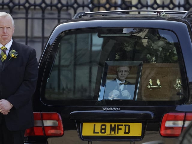 The coffin arrives for the funeral ceremony of Ken Buchanan at St Giles Cathedral on April 25, 2023 in Edinburgh
