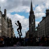 A juggler performs for tourists on the Royal Mile