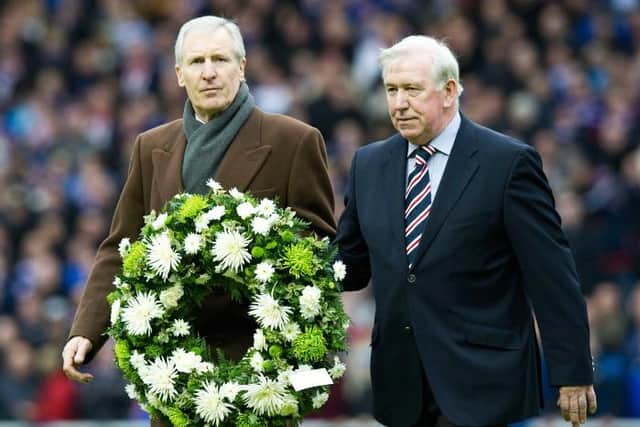 John Greig and his friend and former Old Firm rival, the late Celtic captain Billy McNeill, lay a wreath in 2011 in memory of those killed in the Ibrox Disaster (Picture: Craig Williamson/SNS Group)