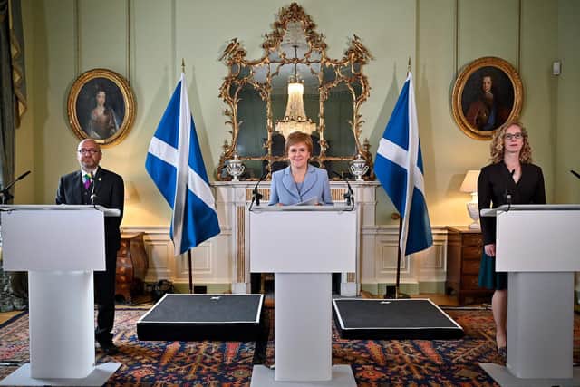 The then First minister Nicola Sturgeon and Scottish Greens co-leaders Patrick Harvie and Lorna Slater announce the Bute House Agreement in 2021, setting up a power-sharing partnership (Picture: Jeff J Mitchell/pool/AFP via Getty Images)