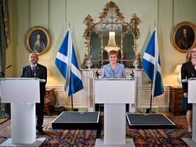 The then First minister Nicola Sturgeon and Scottish Greens co-leaders Patrick Harvie and Lorna Slater announce the Bute House Agreement in 2021, setting up a power-sharing partnership (Picture: Jeff J Mitchell/pool/AFP via Getty Images)