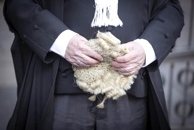 An advocate carrying his wig outside Edinburgh Sheriff Court. Picture: Jane Barlow/PA Wire