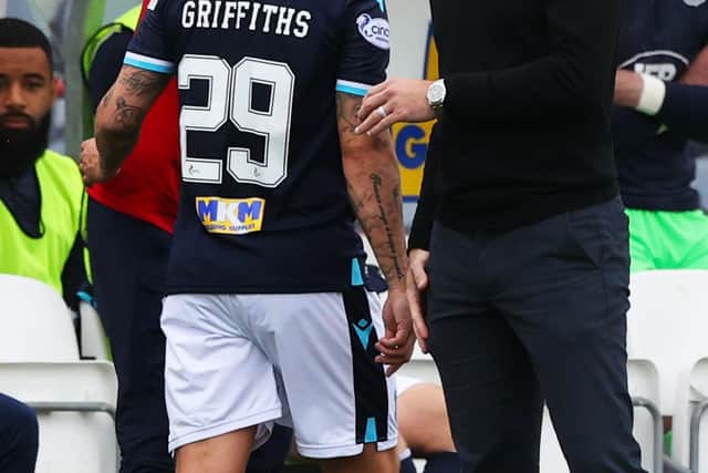 Dundee's Leigh Griffiths with the physio and manager James McPake after coming off.
